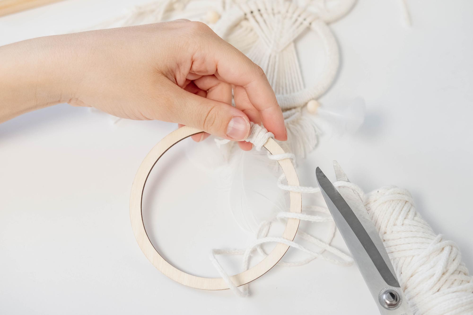 Instructor demonstrating satin stitch on hoop