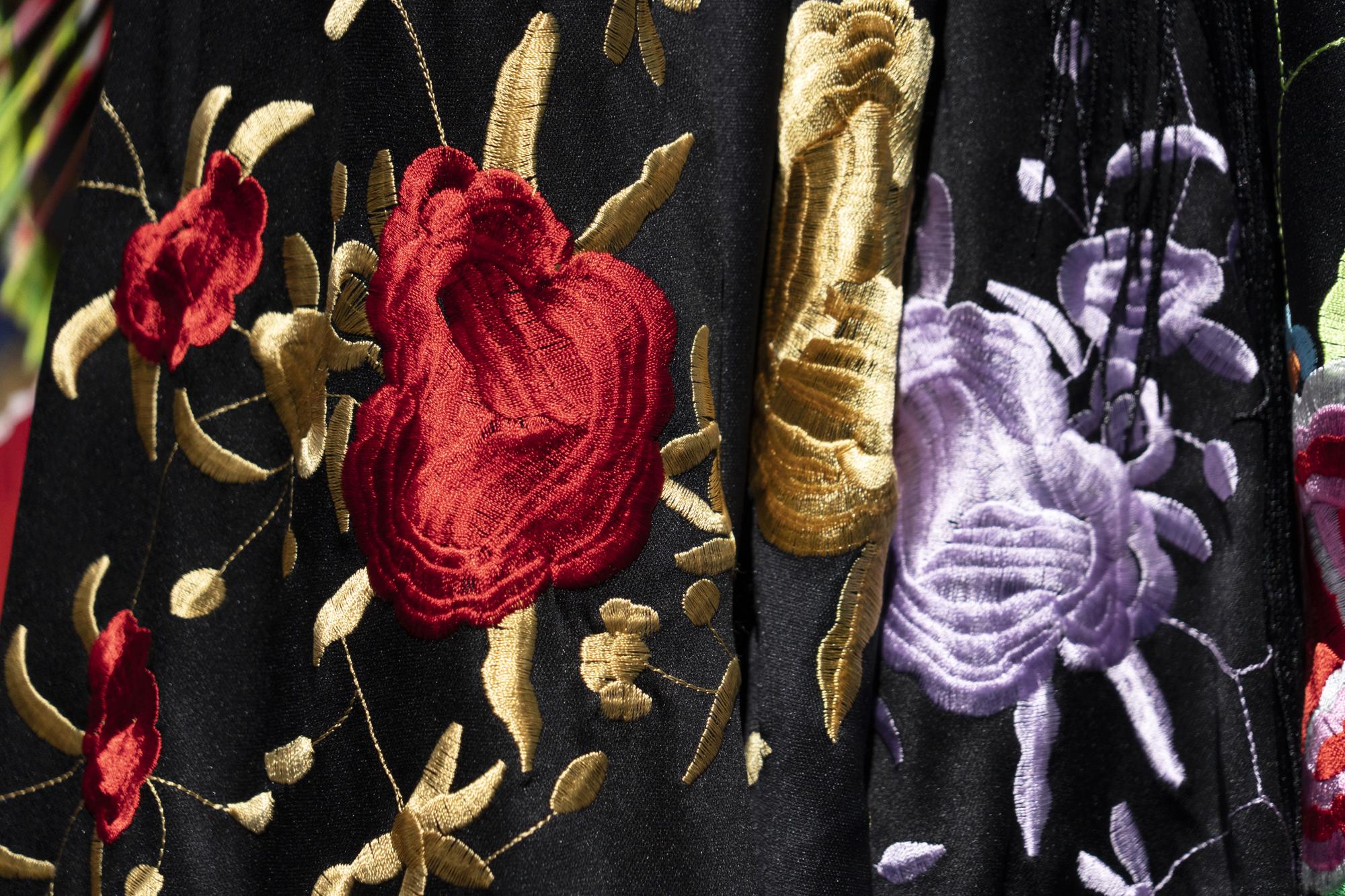 Close-up of luxury embroidered floral pattern on silk